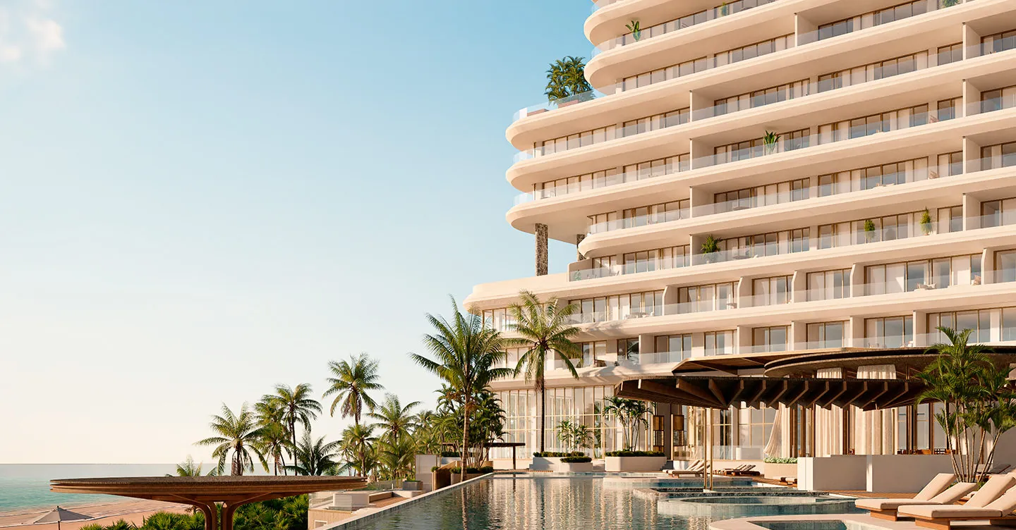 Render del St. Regis Costa Mujeres: torre de terrazas curvas frente al mar, con alberca y palmeras